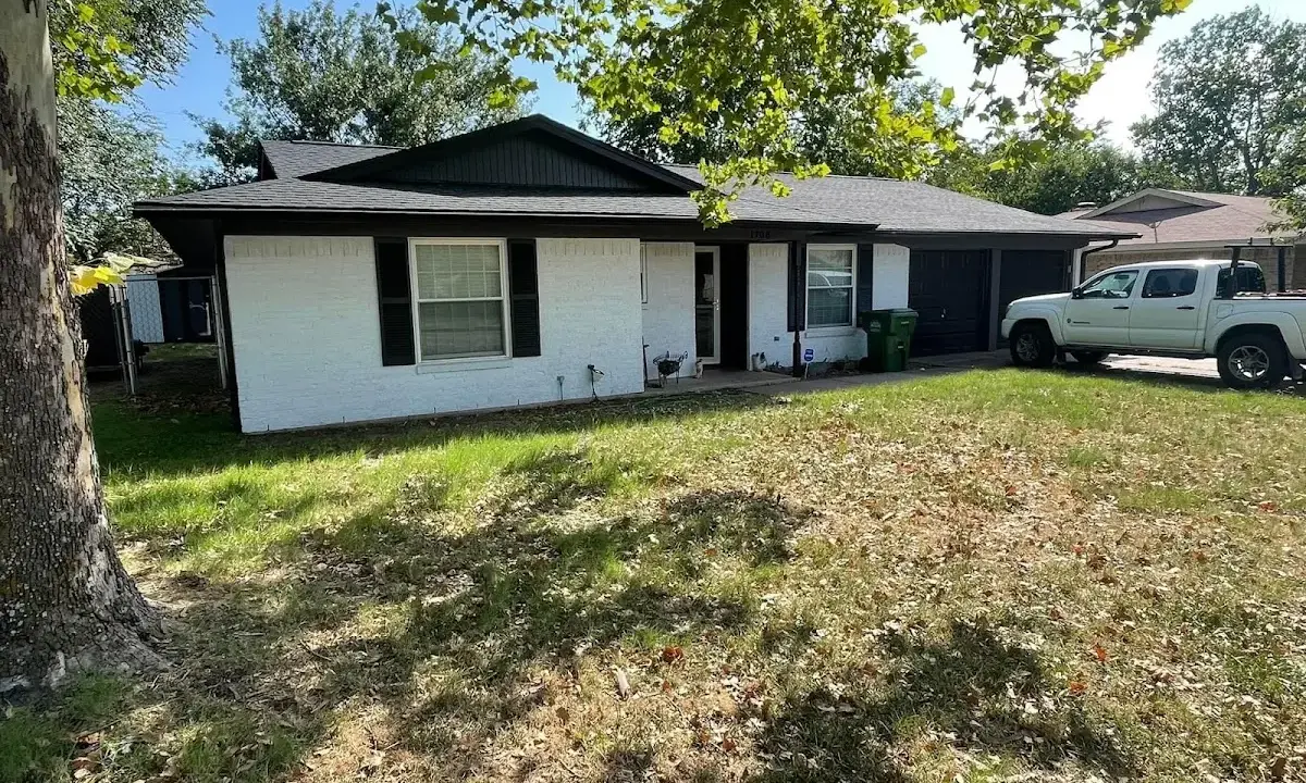 Professional roofing crew working on a residential roof in Twin Lakes